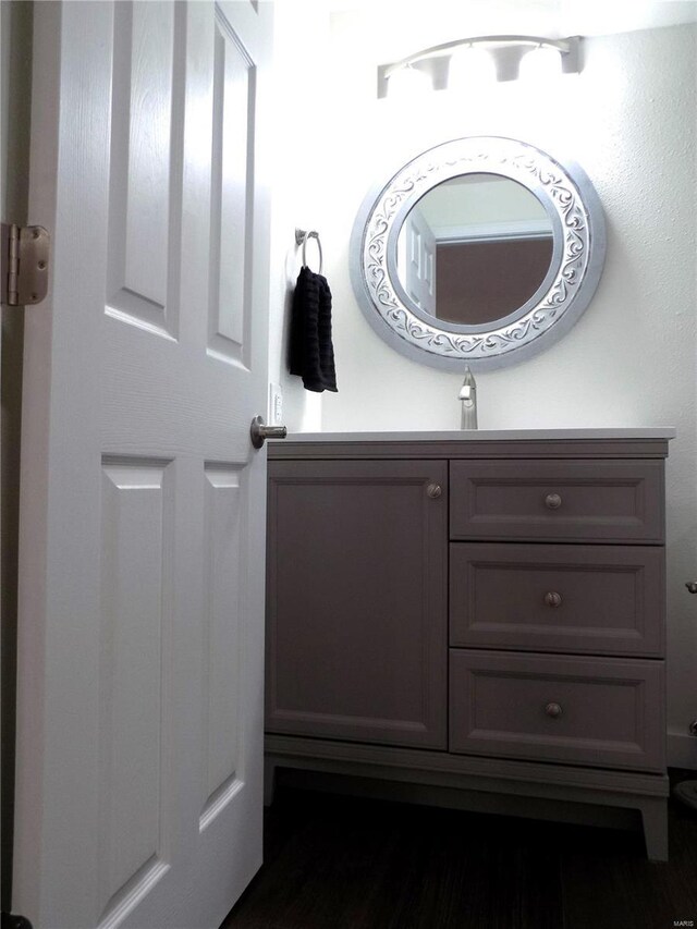 1002 Cypress Dr, Rolla, MO 65401 - bathroom with wood finished floors and vanity