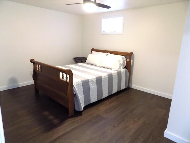 1002 Cypress Dr, Rolla, MO 65401 - bedroom featuring dark wood-style flooring, baseboards, and a ceiling fan