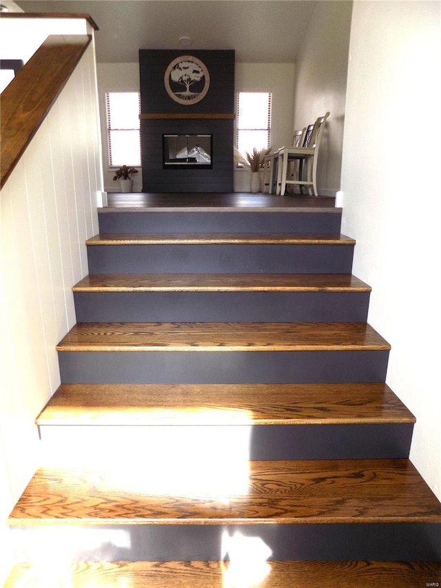 1002 Cypress Dr, Rolla, MO 65401 - staircase with a large fireplace