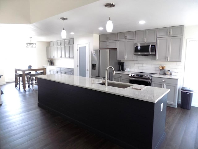 1002 Cypress Dr, Rolla, MO 65401 - kitchen featuring stainless steel appliances, a sink, gray cabinetry, dark wood-style flooring, and recessed lighting