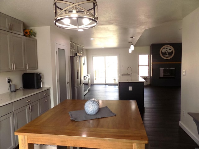 1002 Cypress Dr, Rolla, MO 65401 - dining area featuring dark wood-style floors and a fireplace
