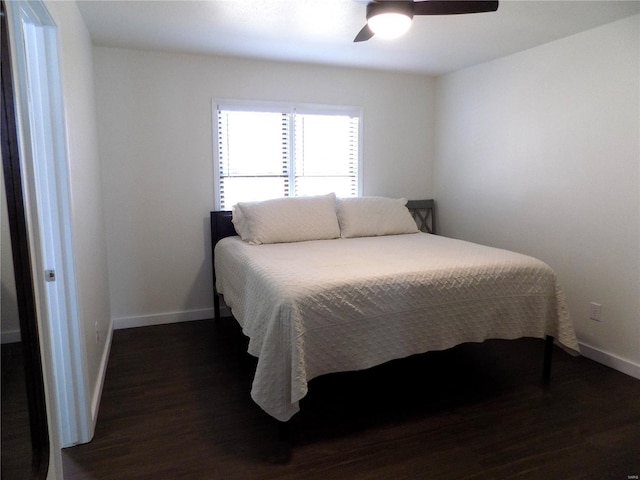 1002 Cypress Dr, Rolla, MO 65401 - bedroom featuring dark wood-style flooring, baseboards, and a ceiling fan