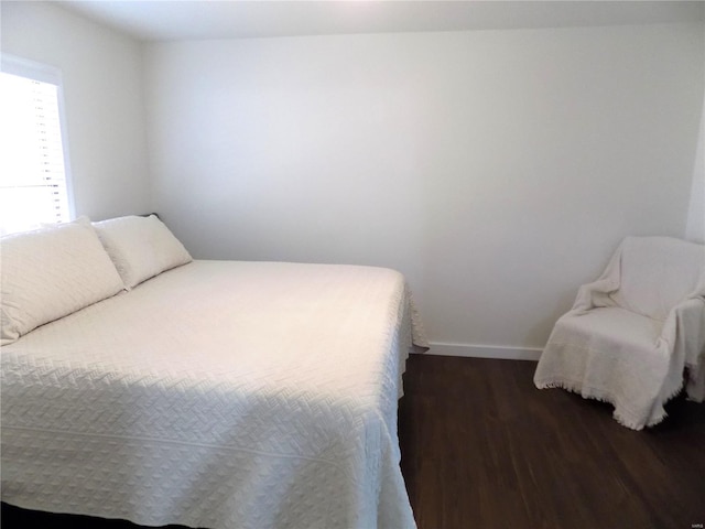 1002 Cypress Dr, Rolla, MO 65401 - bedroom featuring wood finished floors and baseboards