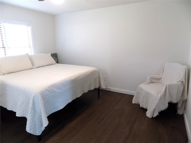 1002 Cypress Dr, Rolla, MO 65401 - bedroom featuring dark wood finished floors and baseboards
