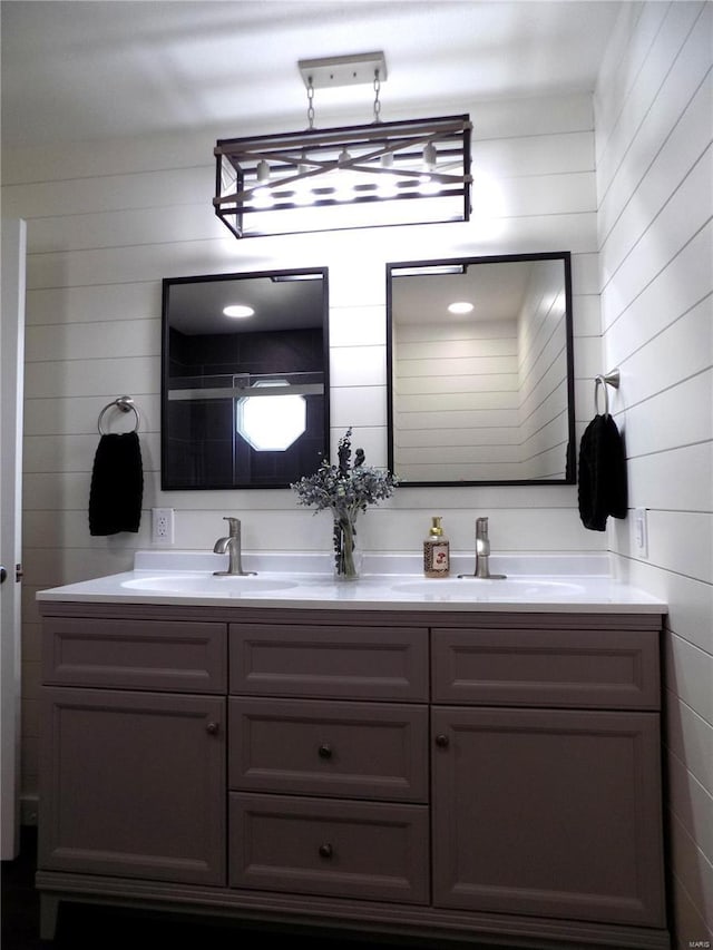 1002 Cypress Dr, Rolla, MO 65401 - full bath featuring double vanity and wooden walls
