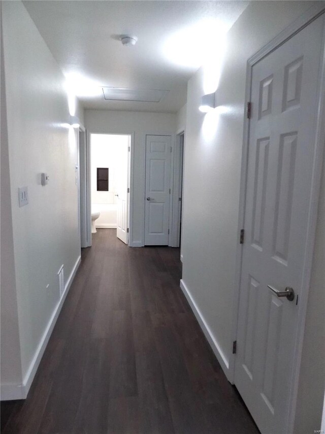 1002 Cypress Dr, Rolla, MO 65401 - hall with baseboards, dark wood-style flooring, and attic access