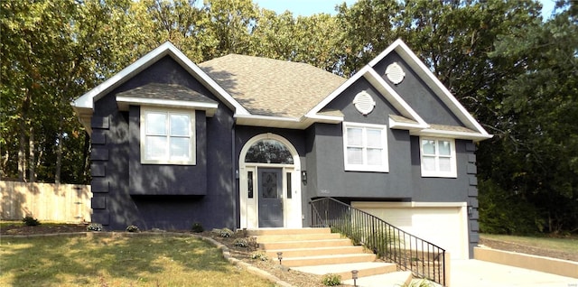 1002 Cypress Dr, Rolla, MO 65401 - raised ranch with roof with shingles, an attached garage, concrete driveway, and stucco siding