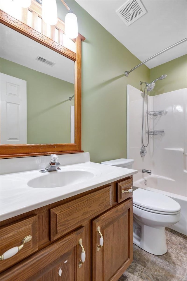 full bath featuring vanity, toilet, and washtub / shower combination