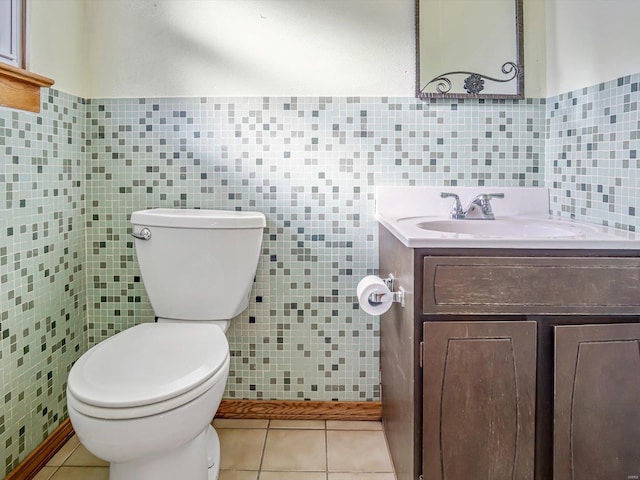 9355 State Route 3, Red Bud, IL 62278 - bathroom featuring tile walls, tile patterned flooring, toilet, vanity, and wainscoting