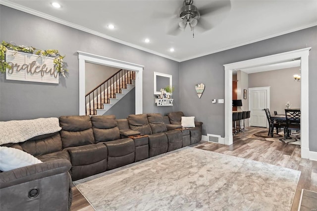 821 N State St, Litchfield, IL 62056 - living area featuring light wood-style floors, a ceiling fan, stairway, ornamental molding, and recessed lighting
