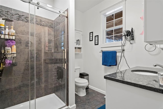 821 N State St, Litchfield, IL 62056 - bathroom with a stall shower, tile patterned floors, baseboards, toilet, and vanity