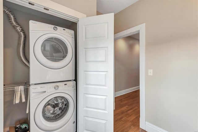 920 Talmage, Saint Louis, MO 63110 - laundry area with stacked washer and clothes dryer, baseboards, and wood finished floors