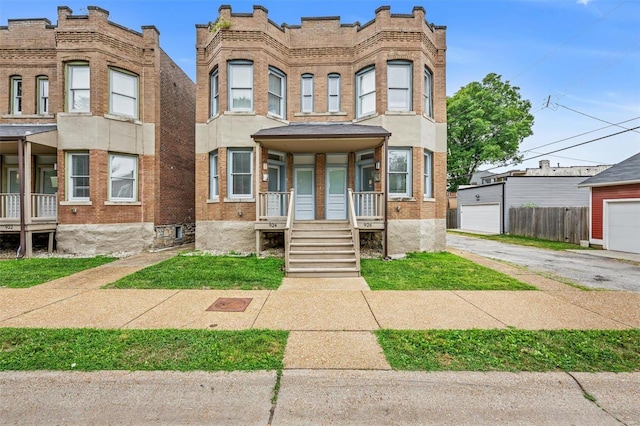 multi unit property featuring brick siding and fence