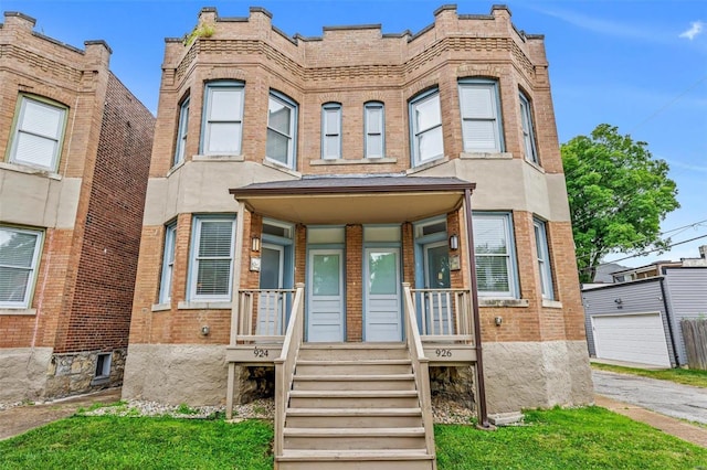 view of front of property with brick siding and covered porch