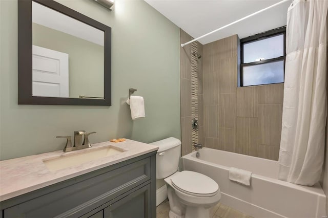 bathroom featuring toilet, shower / bath combo, and vanity