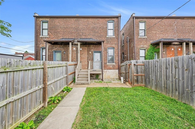 rear view of house featuring brick siding