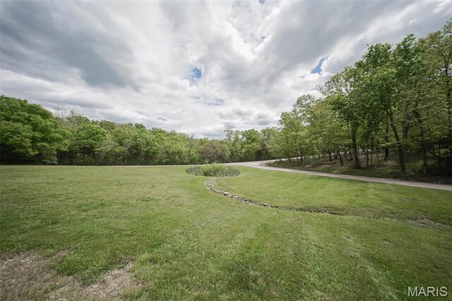 12455 Jefferys Pl, Rolla, MO 65401 - view of green lawn with a view of trees