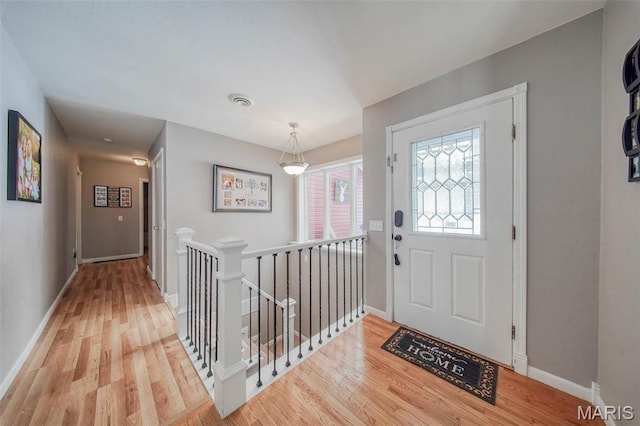 12455 Jefferys Pl, Rolla, MO 65401 - foyer featuring wood finished floors and baseboards