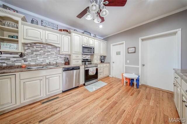 12455 Jefferys Pl, Rolla, MO 65401 - kitchen featuring appliances with stainless steel finishes, ceiling fan, open shelves, tasteful backsplash, and ornamental molding