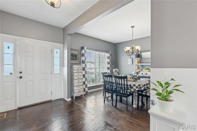 8038 Fox Holw, Barnhart, MO 63012 - foyer entrance with dark wood finished floors, a chandelier, and baseboards