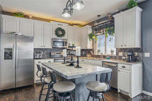 8038 Fox Holw, Barnhart, MO 63012 - kitchen featuring stainless steel appliances, a sink, white cabinets, and dark wood-type flooring