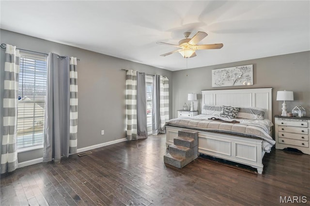 8038 Fox Holw, Barnhart, MO 63012 - bedroom featuring multiple windows, dark wood-type flooring, and baseboards