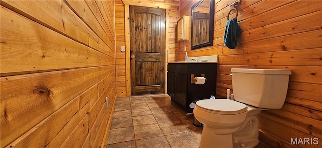 12124 Hamilton Hollow Rd, Sullivan, MO 63080 - half bath featuring wooden walls, vanity, and tile patterned flooring