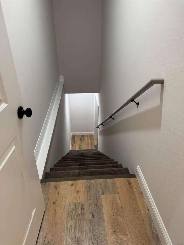 stairs with wood finished floors