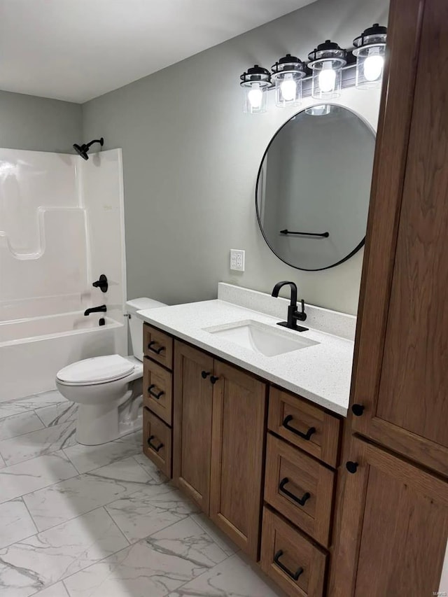 full bathroom featuring marble finish flooring, toilet, vanity, and shower / washtub combination
