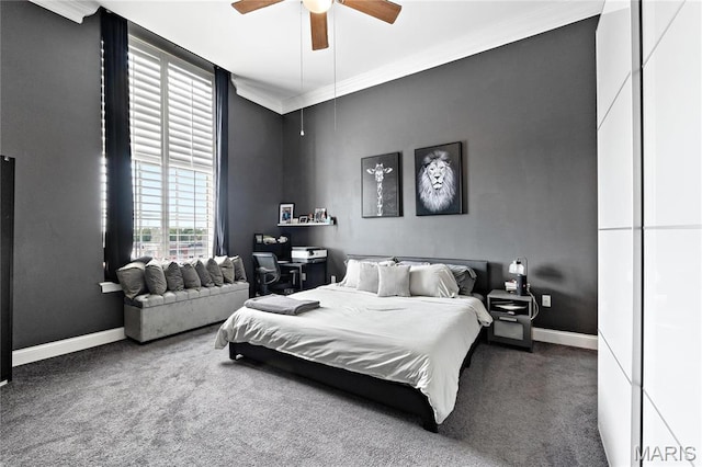 bedroom with carpet flooring, crown molding, baseboards, and a ceiling fan