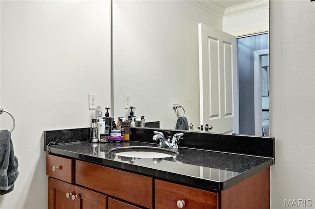 bathroom featuring crown molding and vanity