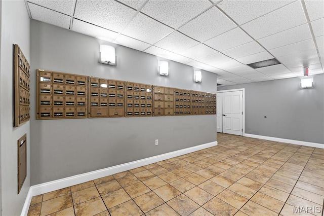 surrounding community with a paneled ceiling and mail area