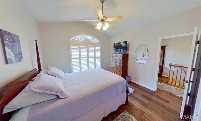 112 Summit Rdg, Maryville, IL 62062 - bedroom with wood finished floors, vaulted ceiling, baseboards, and ceiling fan