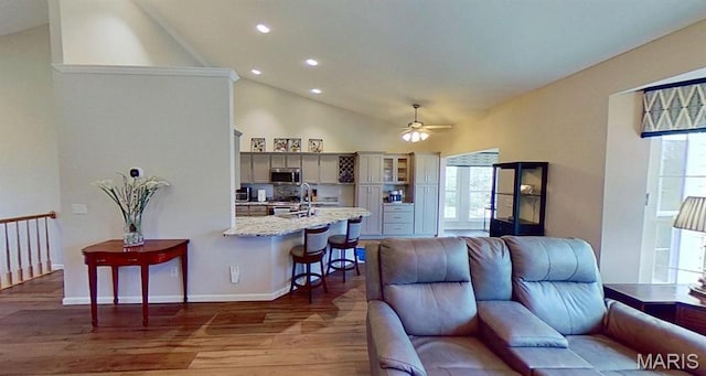 112 Summit Rdg, Maryville, IL 62062 - living room featuring wood finished floors, recessed lighting, a ceiling fan, high vaulted ceiling, and baseboards