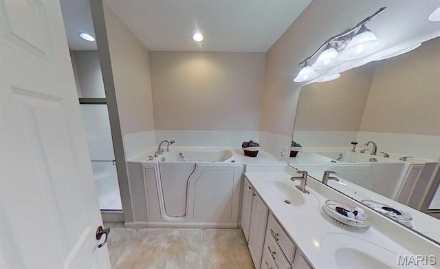 112 Summit Rdg, Maryville, IL 62062 - full bathroom featuring a garden tub and double vanity