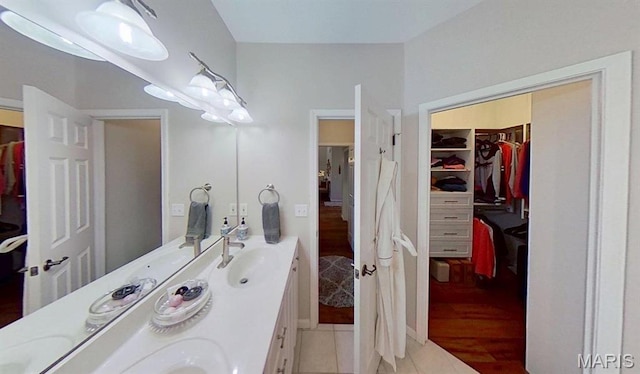 112 Summit Rdg, Maryville, IL 62062 - full bathroom with double vanity, a spacious closet, and wood finished floors