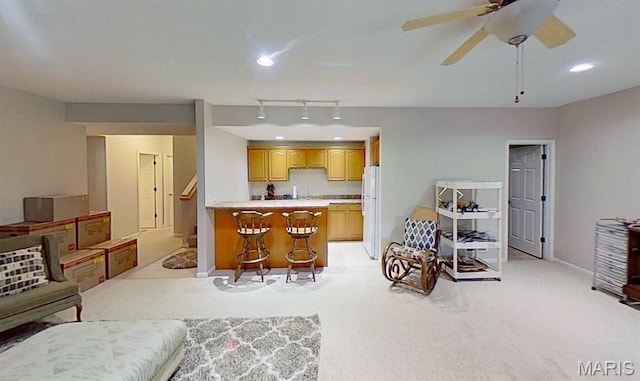 112 Summit Rdg, Maryville, IL 62062 - living room featuring light colored carpet, baseboards, recessed lighting, and a ceiling fan