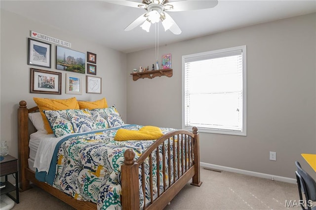 bedroom featuring carpet flooring, baseboards, and ceiling fan