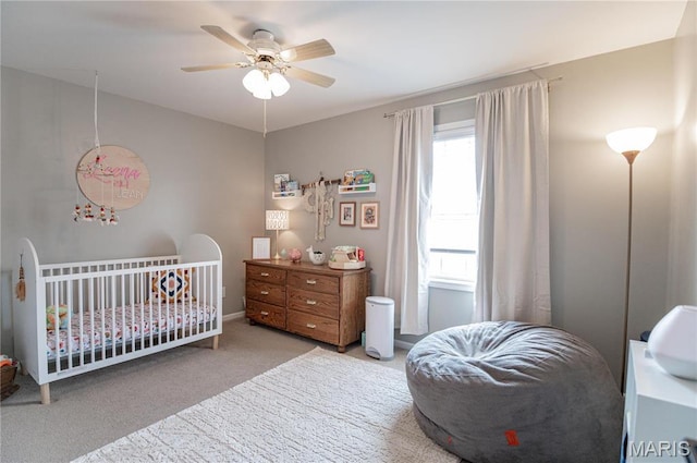 carpeted bedroom featuring a ceiling fan