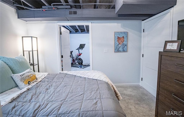 bedroom featuring carpet floors and baseboards