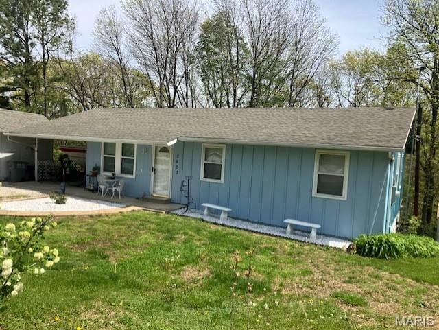 5603 Carter Dr, House Springs, MO 63051 - view of front of house featuring board and batten siding and a front lawn