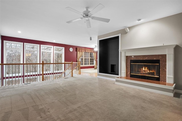 480 Ascot Manor Ct, Fenton, MO 63026 - unfurnished living room featuring carpet floors, a fireplace, a ceiling fan, and recessed lighting