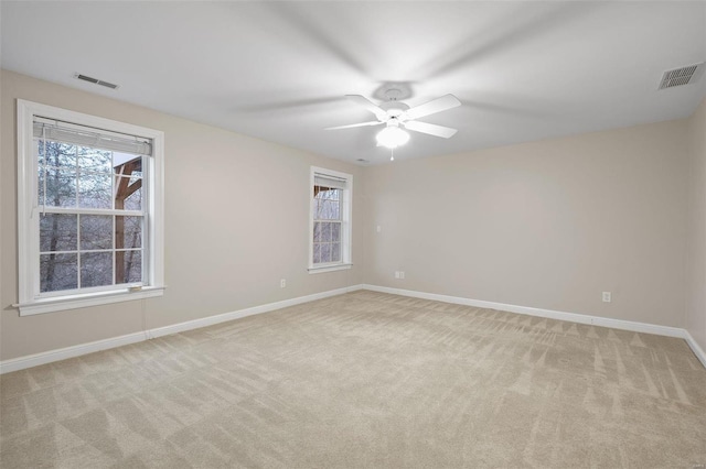 480 Ascot Manor Ct, Fenton, MO 63026 - spare room featuring light carpet, baseboards, and ceiling fan