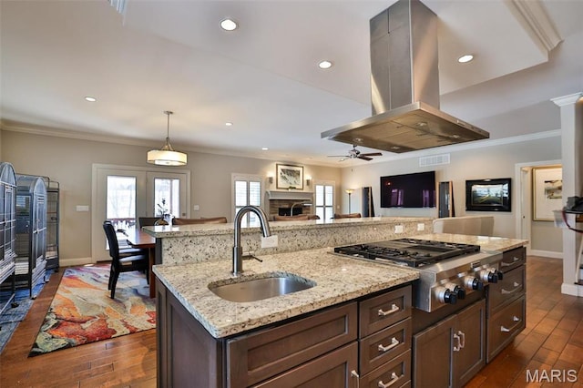 1120 Franklin Ave, Edwardsville, IL 62025 - kitchen featuring island exhaust hood, stainless steel gas cooktop, open floor plan, dark wood-style flooring, and a ceiling fan