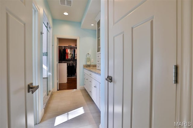 1120 Franklin Ave, Edwardsville, IL 62025 - full bathroom with a shower stall, a walk in closet, vanity, and recessed lighting