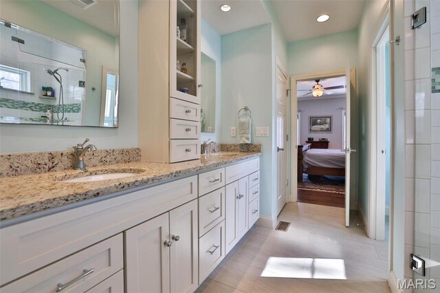 1120 Franklin Ave, Edwardsville, IL 62025 - full bathroom with double vanity, a stall shower, ensuite bathroom, a ceiling fan, and plenty of natural light