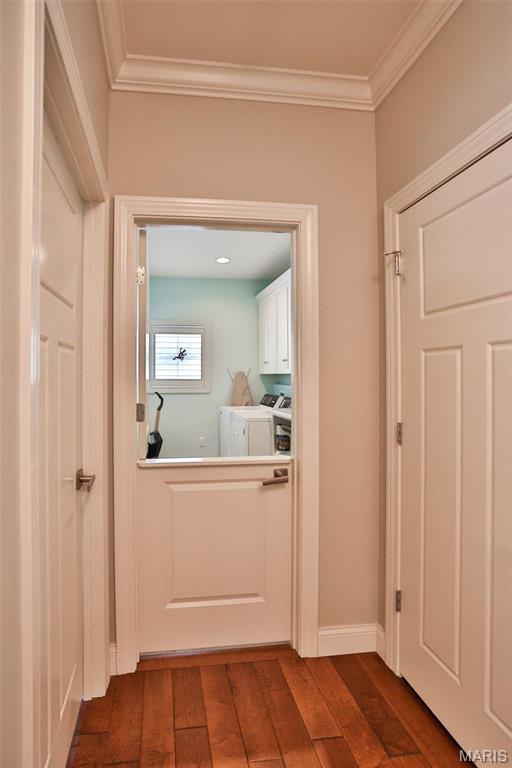 1120 Franklin Ave, Edwardsville, IL 62025 - hallway featuring washing machine and clothes dryer, crown molding, and hardwood / wood-style floors