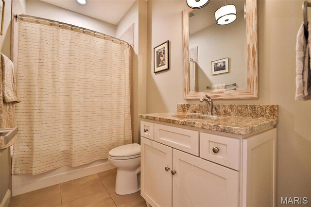 1120 Franklin Ave, Edwardsville, IL 62025 - bathroom featuring vanity, tile patterned flooring, and shower / bathtub combination with curtain