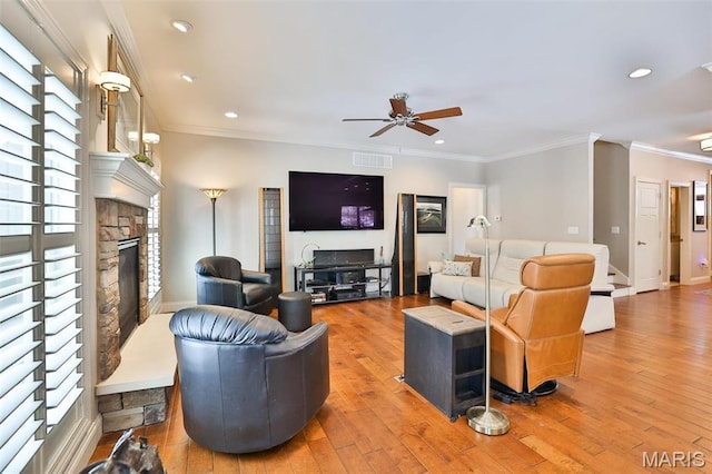 1120 Franklin Ave, Edwardsville, IL 62025 - living room with a fireplace, a ceiling fan, wood finished floors, crown molding, and recessed lighting