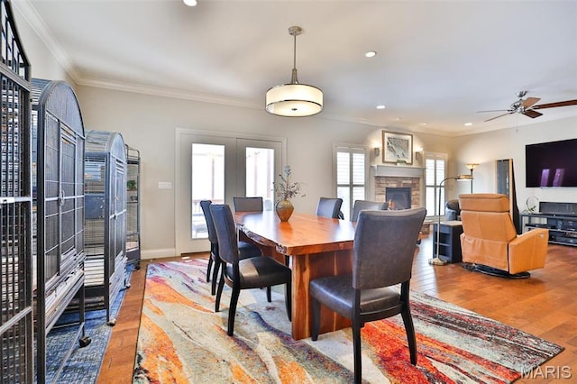 1120 Franklin Ave, Edwardsville, IL 62025 - dining room with hardwood / wood-style flooring, ornamental molding, a stone fireplace, ceiling fan, and recessed lighting